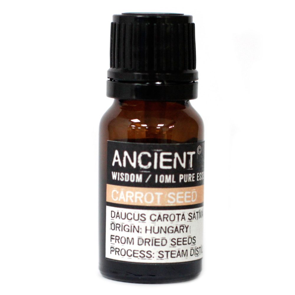 A small brown bottle stands against a white background. It features a black cap and a label with the text "ANCIENT WISDOM/10ML PURE ESS CARROT SEED DAUCUS CAROTA SATIV ORIGIN: HUNGARY FROM DRIED SEEDS PROCESS: STEAM DIST".