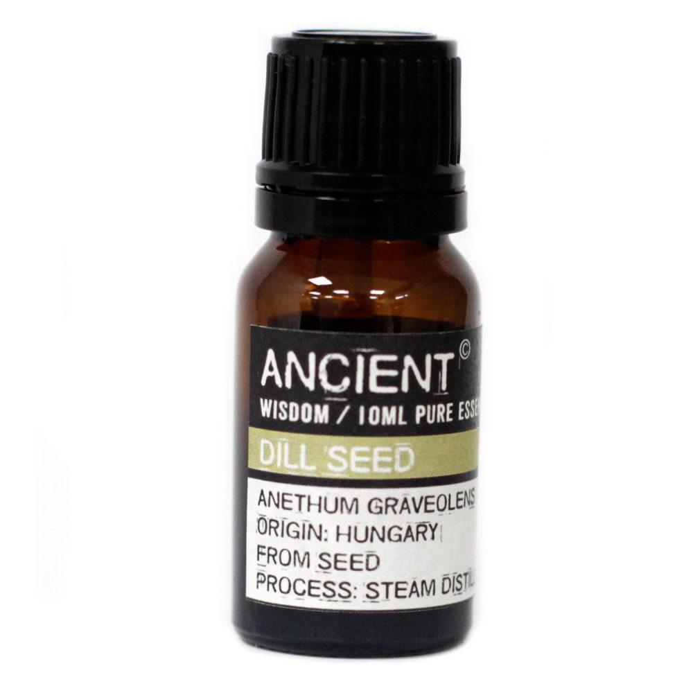 A brown glass bottle of "Ancient Wisdom / 10ml Pure Essence Dill Seed" sits upright. Labeling shows "Anethum Graveolens, Origin: Hungary, From Seed, Process: Steam Distilled". It rests on a white surface.