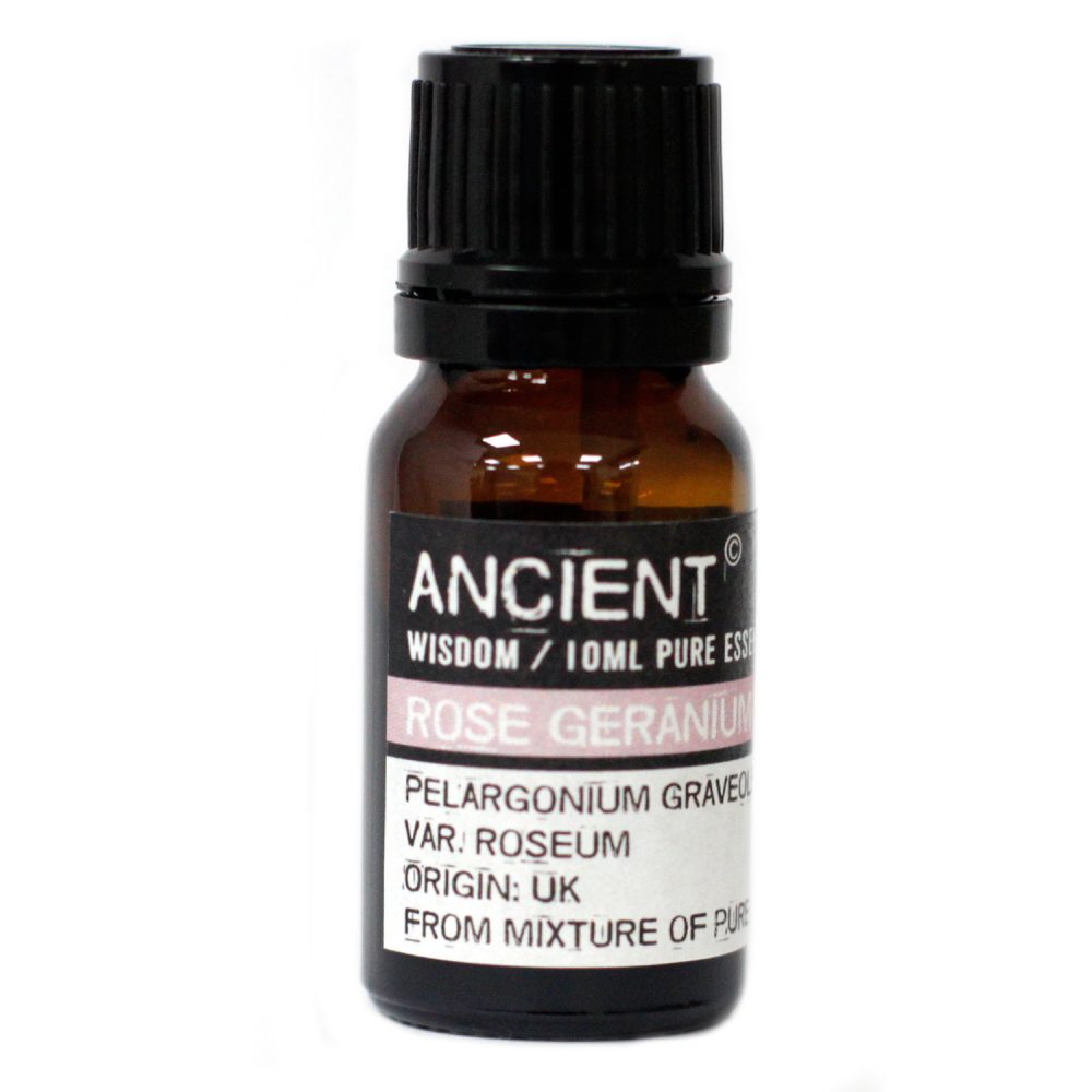 A small brown bottle displays a label with "ANCIENT" and "WISDOM/10ML PURE ESS," "ROSE GERANIUM" and "PELARGONIUM GRAVEO. VAR. ROSEUM, ORIGIN: UK, FROM MIXTURE OF PUR" printed on it.