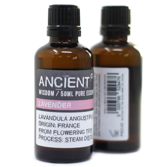 Two brown glass bottles sit against a white backdrop. The label on the front bottle reads: "ANCIENT WISDOM / 50ML PURE ESSEN L'AVENDER LAVANDULA ANGUSTIFOL ORIGIN: FRANCE FROM FLOWERING TIPS PROCESS: STEAM DISTIL."