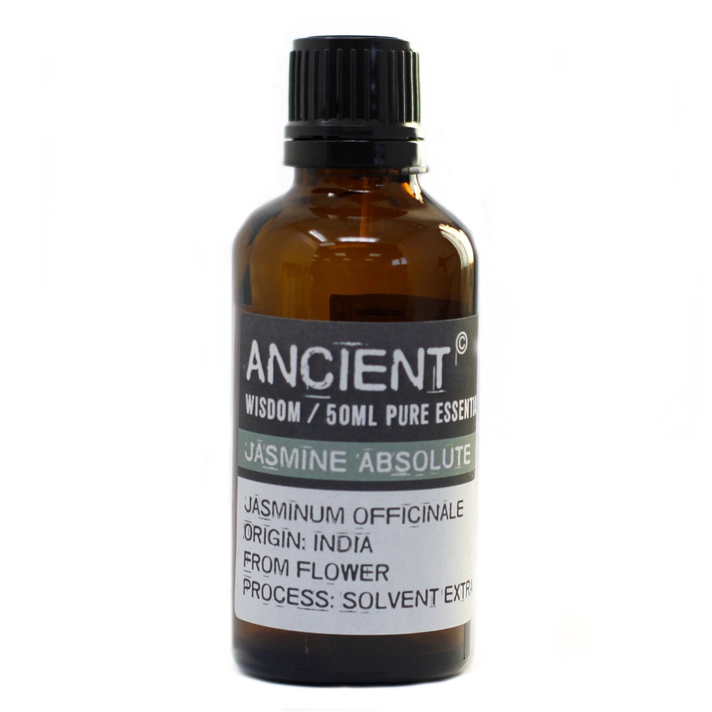 A dark glass bottle stands on a white surface. The bottle's label reads "ANCIENT WISDOM / 50ML PURE ESSENT, JASMINE ABSOLUTE, JASMINUM OFFICINALE, ORIGIN: INDIA, FROM FLOWER, PROCESS: SOLVENT EXTRA."