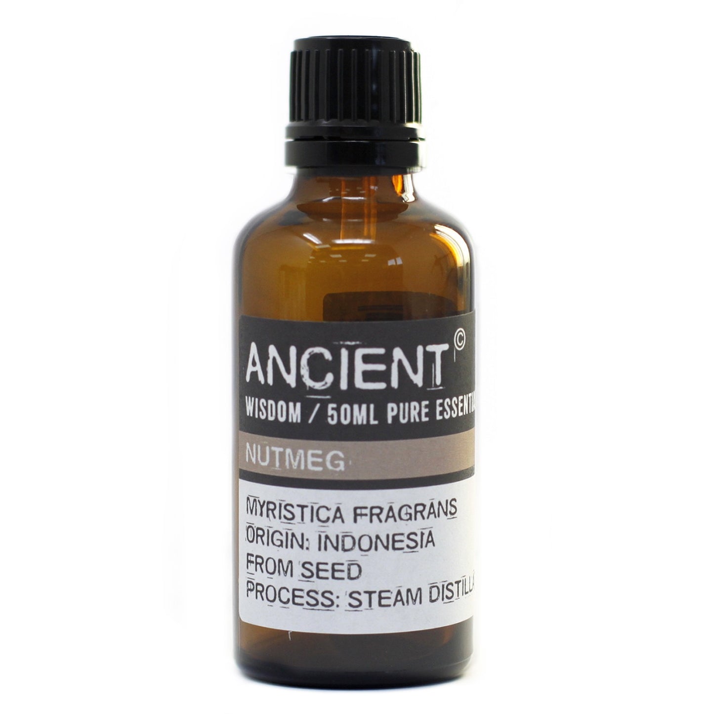 A dark amber bottle stands on a white surface. A label reads "ANCIENT WISDOM/50ML PURE ESSENT NUTMEG MYRISTICA FRAGRANS ORIGIN: INDONESIA FROM SEED PROCESS: STEAM DISTILU."