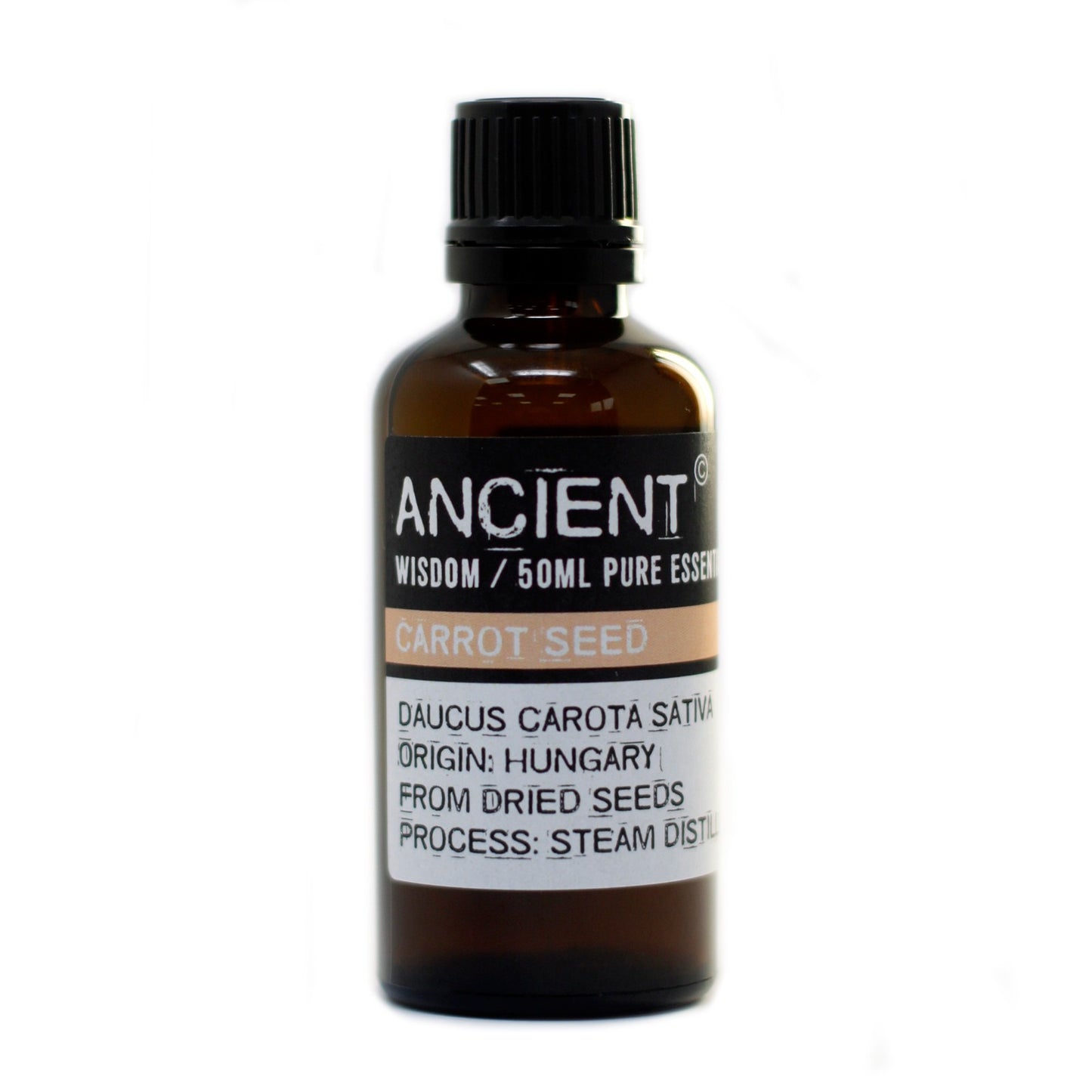 A small, amber bottle stands in a white space. Its label reads "ANCIENT WISDOM/50ML PURE ESSEN CARROT SEED DAUCUS CAROTA SATIVA ORIGIN: HUNGARY FROM DRIED SEEDS PROCESS: STEAM DISTIL".