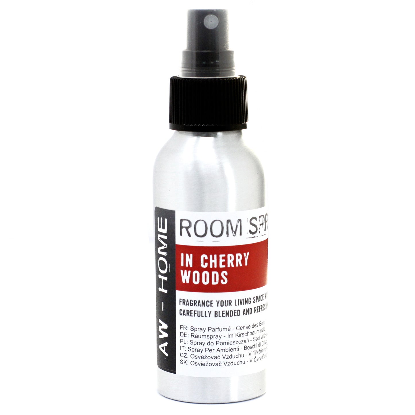 A silver spray bottle, dispensing room fragrance, sits against a white background. The label reads: "ROOM SPRAY IN CHERRY WOODS," along with multilingual descriptions.