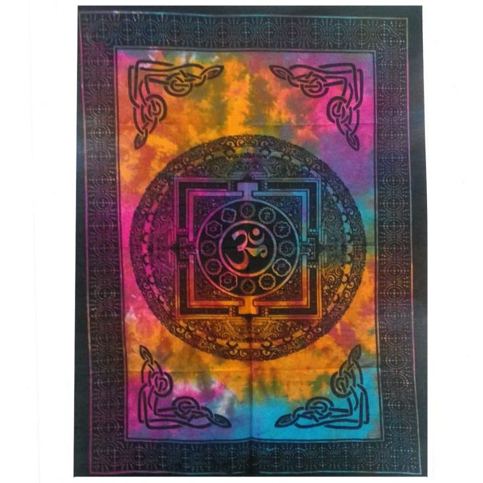 A tie-dye tapestry displays a central Om symbol within a mandala design. The tapestry features a dark border with Celtic knotwork in the corners, against a multicolored background.
