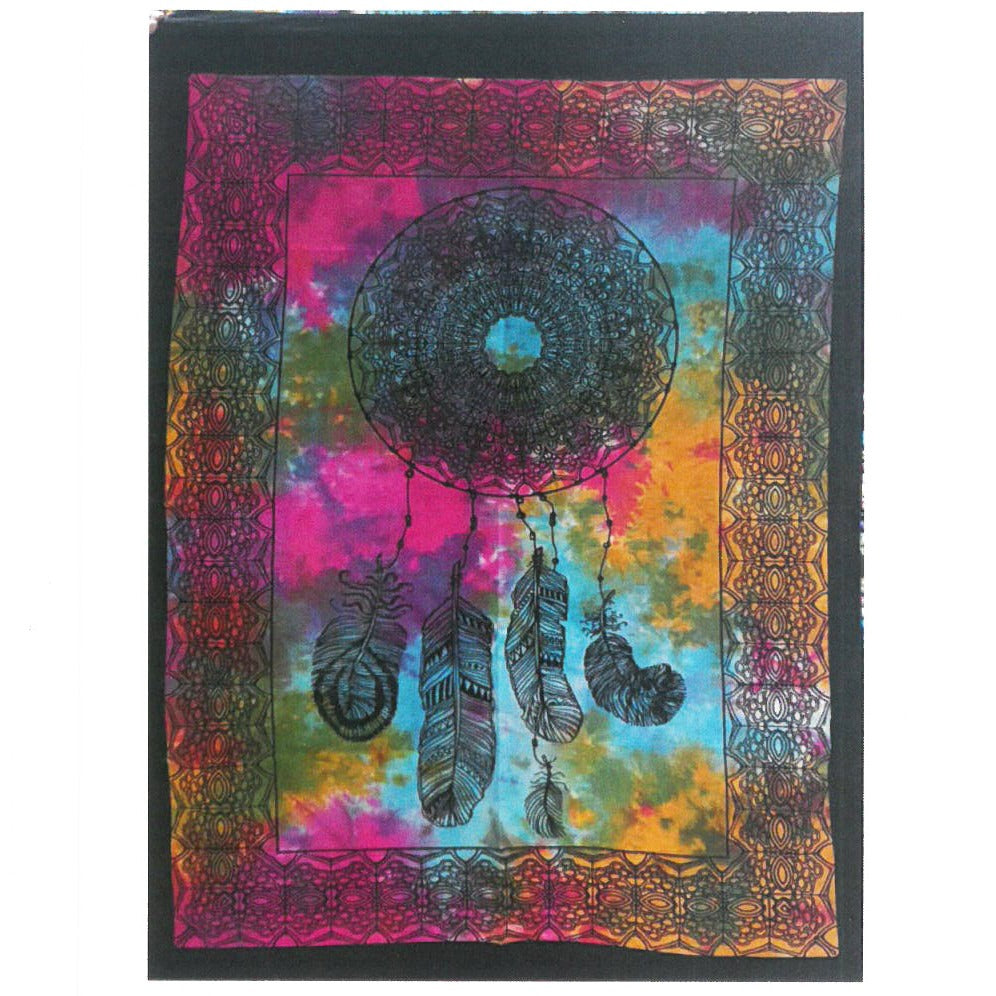 A tie-dye tapestry displays a dreamcatcher design; the tapestry hangs against an unseen background.