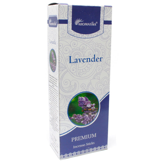 Box displaying "Aromatika Lavender Premium Incense Sticks" features a lavender plant image, ornate white patterns on a blue background, in a standing, unopened position.