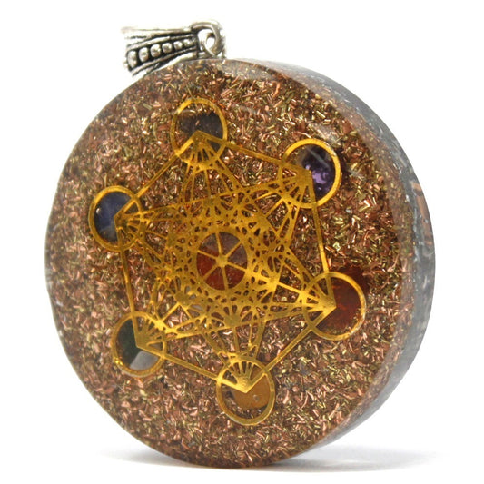 A round pendant containing copper flakes displays a gold-colored Metatron's Cube symbol and stones. The pendant has a silver-colored bail at the top and sits against a white background.