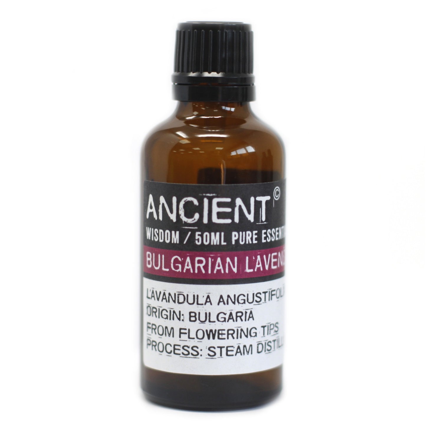 A small, brown bottle of "ANCIENT" Bulgarian Lavender essential oil stands on a white surface. The label text reads: "ANCIENT Wisdom / 50ML PURE ESSENT BULGARIAN LAVEN LAVANDULA ANGUSTIFOL ORIGIN: BULGARIA FROM FLOWERING TIPS PROCESS: STEAM DISTIL."