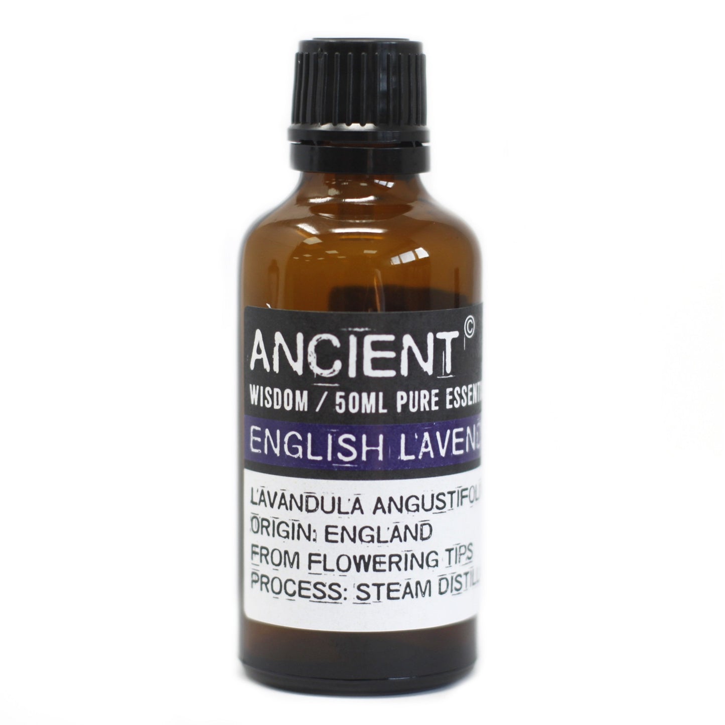 A brown glass bottle of lavender essential oil sits on a white surface. The label reads: "ANCIENT WISDOM / 50ML PURE ESSEN ENGLISH L'AVEN LAVANDULA ANGUSTIFOL ORIGIN: ENGLAND FROM FLOWERING TIPS PROCESS: STEAM DISTIL."