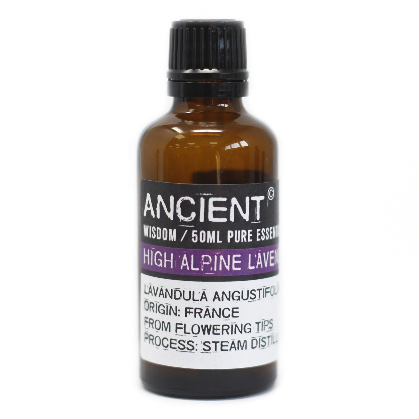 A small brown bottle labeled "ANCIENT WISDOM/50ML PURE ESSENT HIGH ALPINE L'AVE LAVANDULA ANGUSTIFOL ORIGIN: FRANCE FROM FLOWERING TIPS PROCESS: STEAM DISTILL" stands on a white surface.