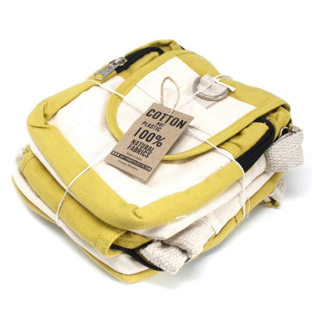 Stacked, cream and yellow, zip-closure bags are tied with twine on a white background. Tag reads: "COTTON NOT PLASTIC 100% NATURAL FABRICS Made in India WWW.COTTONNOTPLASTIC.COM Ancient Wisdom."