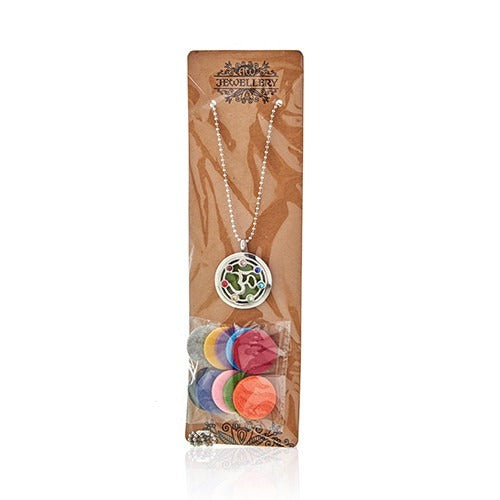 A necklace with colored stones hangs on a cardboard display card with text “JEWELLERY”. Colored felt pads are packaged below.