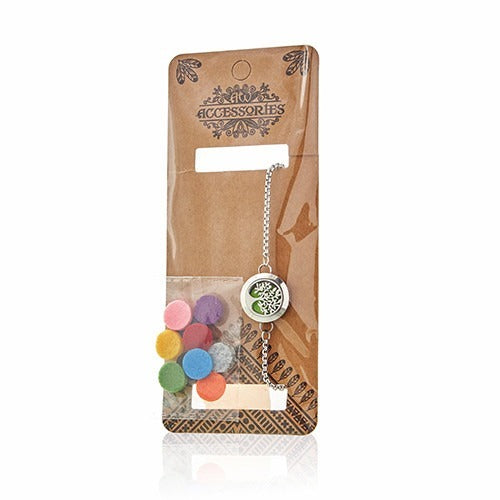 A necklace with a tree-shaped diffuser is packaged with colorful felt pads on a tan cardboard backing labeled "ACCESSORIES" that has a plastic film over the items.