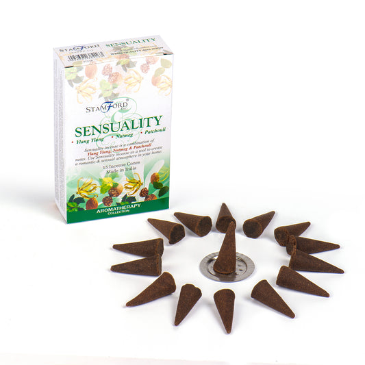 Incense cones arranged around a metal holder; beside a box labeled "Stamford Sensuality," with text: Ylang Ylang, Nutmeg, Patchouli. 15 incense cones, made in India, Aromatherapy Collection.