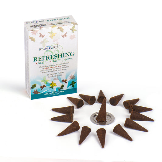 Incense cones are arranged around a circular holder. A box labeled "STAMFORD REFRESHING" details scents of mint, sage, and clove. Text: "15 Incense Cones, Made in India, AROMATHERAPY COLLECTION."