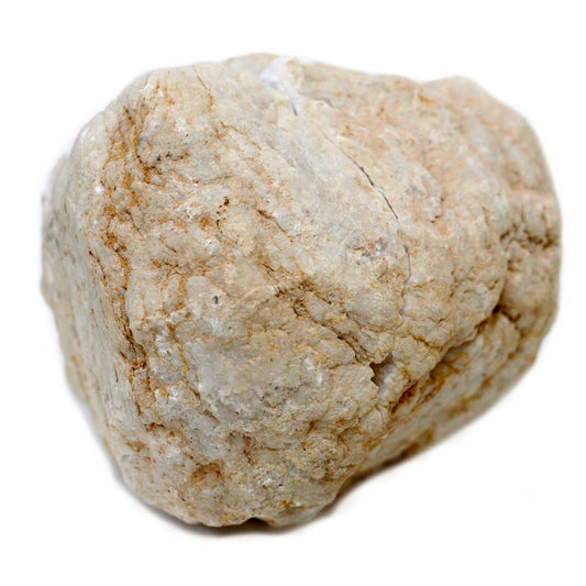 A beige, slightly-textured rock sits on a white surface. Its shape is somewhat blocky but rounded, featuring hints of orange along its surface.