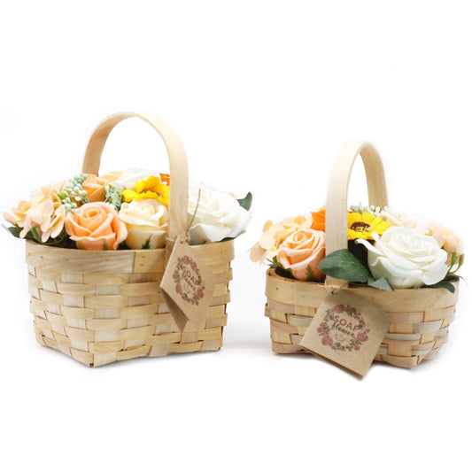 Two small woven baskets hold pastel soap roses and a yellow sunflower under arched wooden handles on a white background; tags read "SOAP flower"