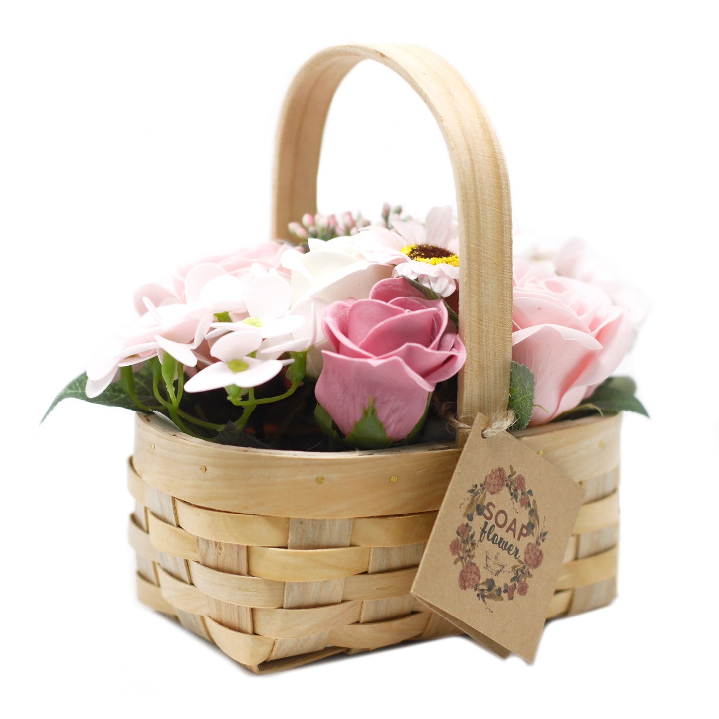 A light wood basket holds an assortment of pink and white flowers. A tag attached to the basket reads, "SOAP flower," surrounded by a decorative floral wreath.