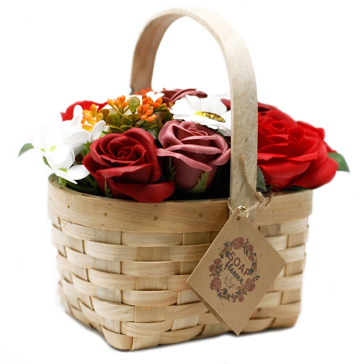 A woven basket holds red, orange, and white soap flowers. A tag with the words "SOAP Flower" dangles from the basket's handle, all against a white backdrop.