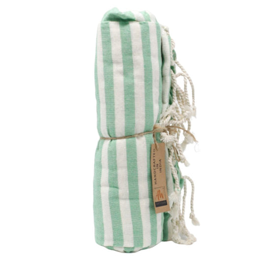 A mint green and white striped towel is rolled and tied with twine. A label reading "HANDCRAFTED IN INDIA" is attached.