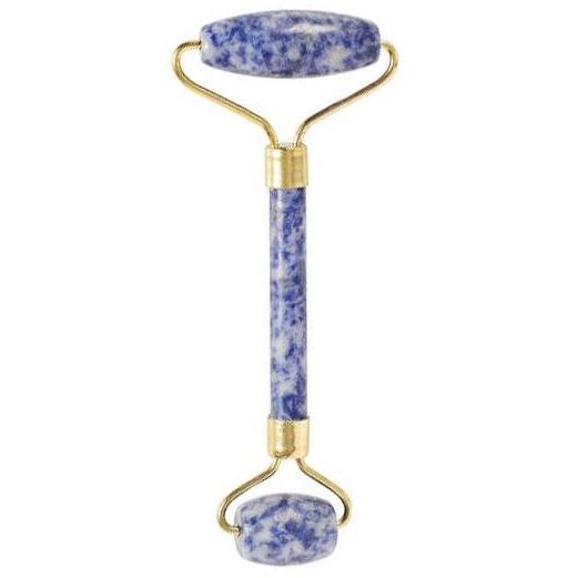 A facial roller, made of blue and white stone with a gold metal frame, is shown against a plain white background.