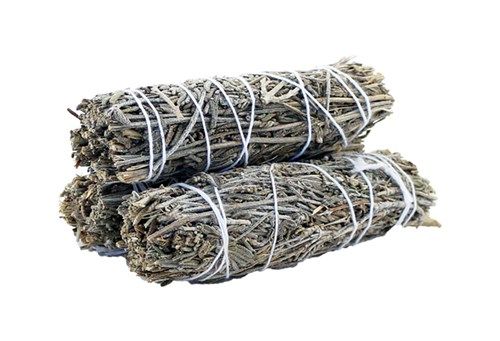 Three bundles of gray sage sit stacked, wrapped tightly with white string. The background is solid white.