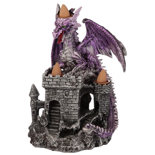 A purple dragon figurine perches atop a stone castle incense burner, with three cone incense holders placed strategically around its structure.
