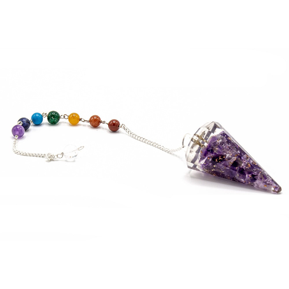 A cone-shaped, purple-filled pendulum is attached to a silver chain and a row of seven colored chakra beads, all displayed on a white background.