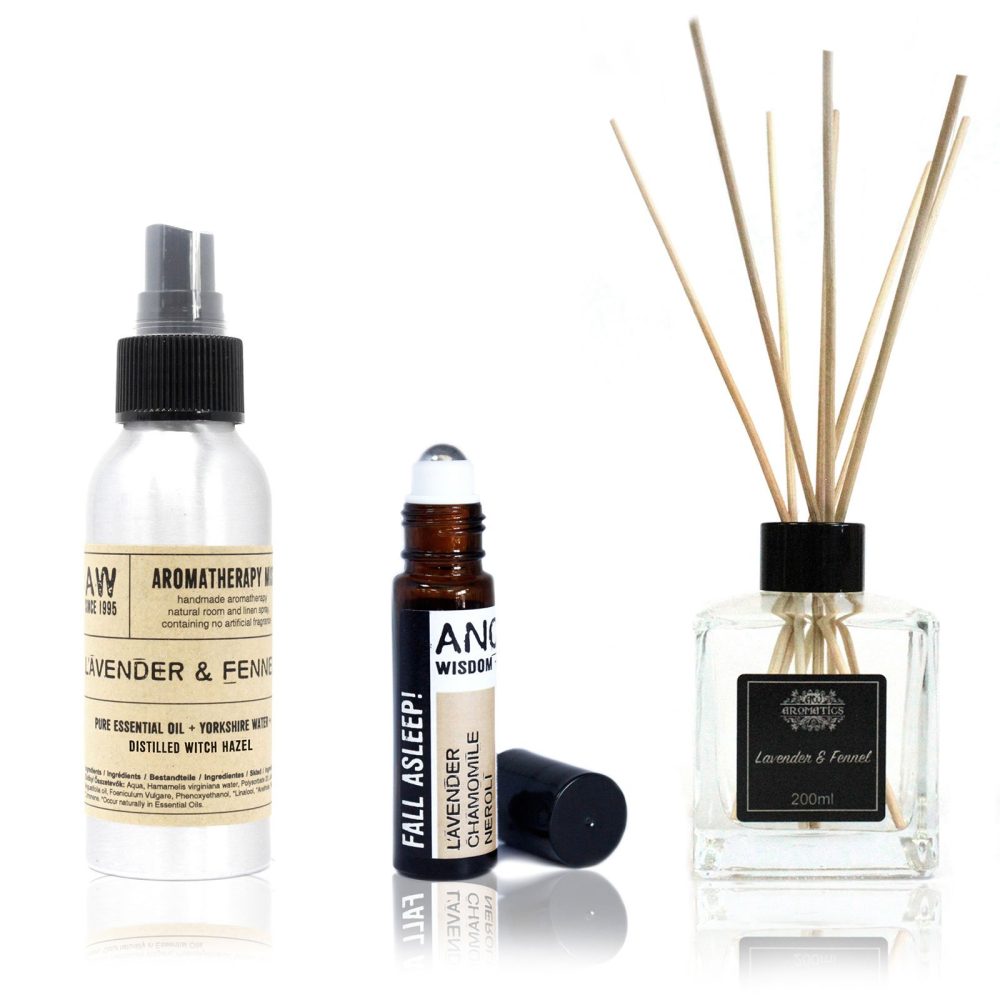 Three aromatherapy products sit on a white background: a spray bottle, a rollerball bottle, and a diffuser. The spray bottle and diffuser are labeled "Lavender & Fennel," the rollerball bottle, "Fall Asleep!"