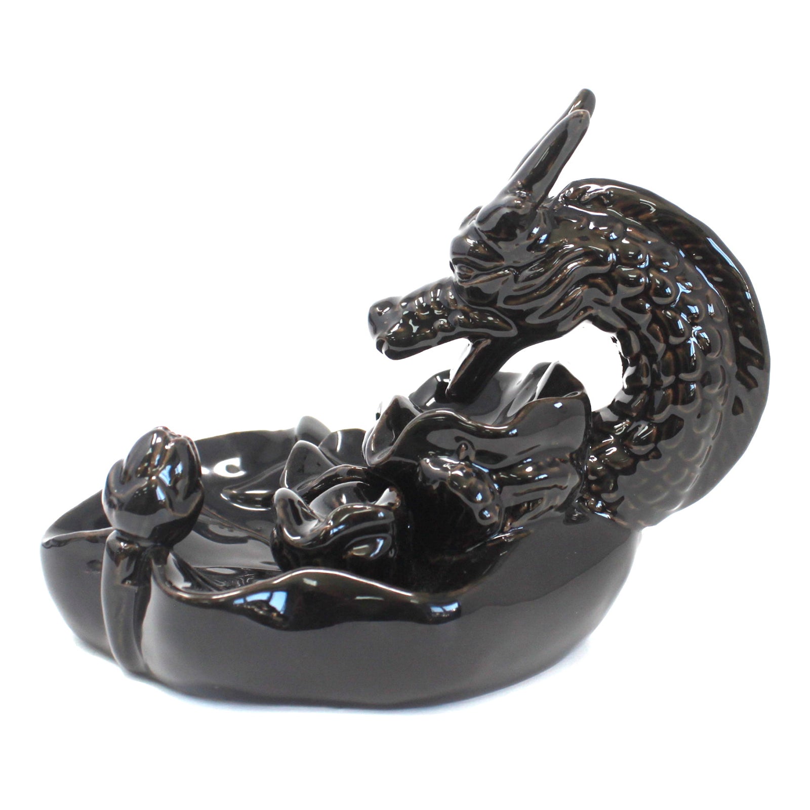 A glossy black ceramic dragon figurine forms a circular arch, its head pointing forward, resting on a textured base resembling flowing water, with floral motifs accenting the design.