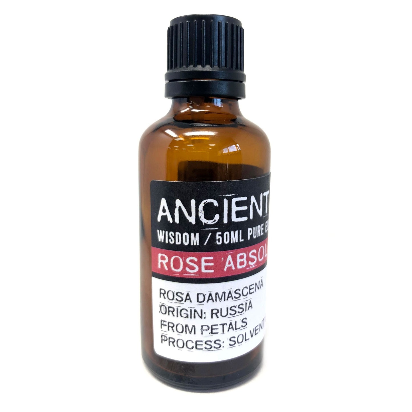 A brown glass bottle of "ANCIENT WISDOM / 50ML PURE" Rose Absolute stands on a white surface. The label states "ROSA DAMASCENA ORIGIN: RUSSIA FROM PETALS PROCESS: SOLVENT."