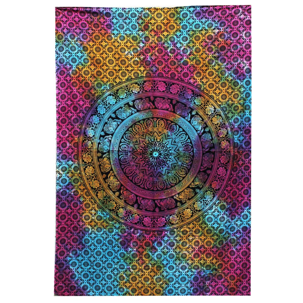 A tie-dye tapestry displays a central mandala featuring elephants, surrounded by a repeating pattern. The colors are predominantly pink, teal, and gold, creating a vibrant, circular design.