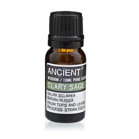 A small brown bottle of "ANCIENT" brand clary sage essential oil sits on a white surface. The label includes the text: "ANCIENT WISDOM / 10ML PURE ESSEN CLARY SAGE SALVIA SCLAREA ORIGIN: RUSSIA FROM TOPS AND LEAVES PROCESS: STEAM DISTILL".