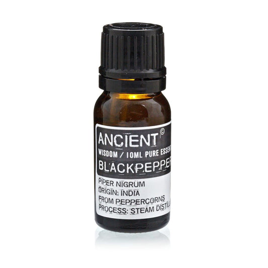 A small, brown bottle of essential oil is sitting on a white surface. The label reads "ANCIENT WISDOM / 10ML PURE ESSEN BLACKPEPPE PIPER NIGRUM ORIGIN: INDIA FROM PEPPERCORNS PROCESS: STEAM DISTILL".