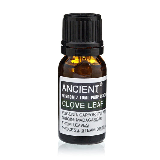 A bottle of essential oil stands, labeled "ANCIENT WISDOM/10ML PURE ESSENT," and "CLOVE LEAF EUGENIA CARYOPHYLLATA ORIGIN: MADAGASCAR FROM LEAVES PROCESS: STEAM DISTILL" against a bright white background.