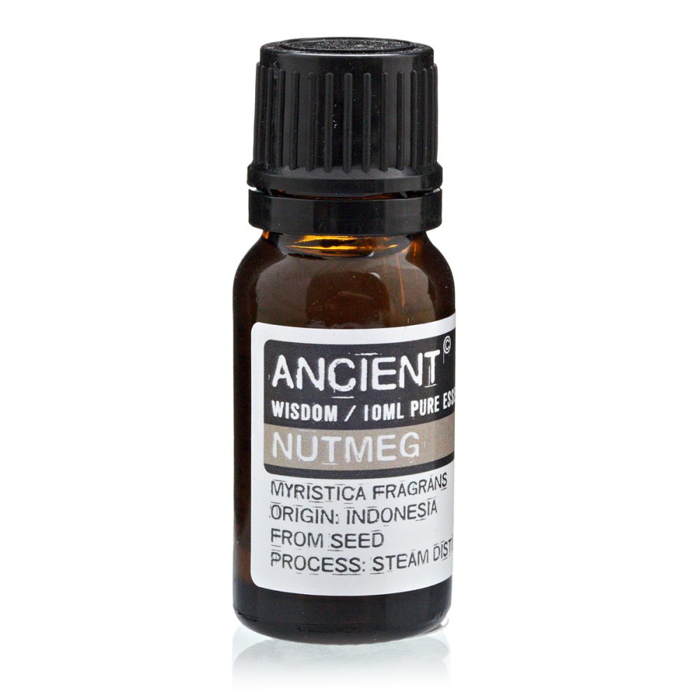 A brown glass bottle labeled "ANCIENT WISDOM / 10ML PURE ESS NUTMEG," sits on a reflective white surface. Text also details: "MYRISTICA FRAGRANS ORIGIN: INDONESIA FROM SEED PROCESS: STEAM DIST".