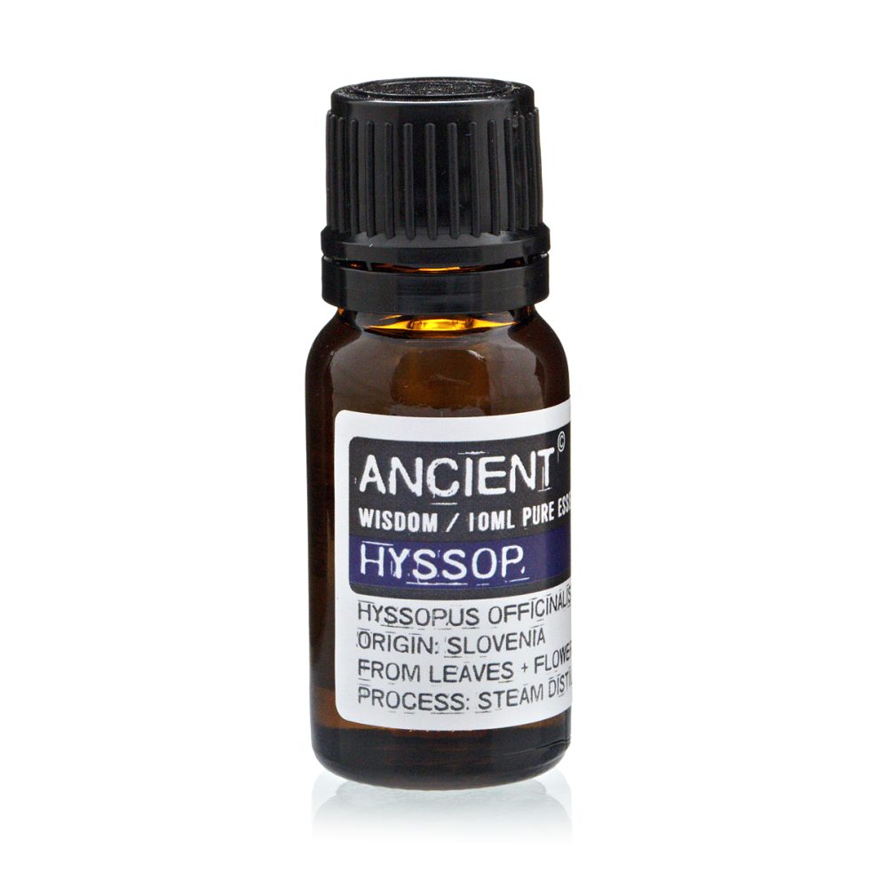 A small bottle of "ANCIENT HYSSOP" essential oil sits on a white surface, its label stating: "WISDOM / 10ML PURE ES", "HYSSOPUS OFFICINALIS", "ORIGIN: SLOVENIA", "FROM LEAVES + FLOWE", and "PROCESS: STEAM DIST".