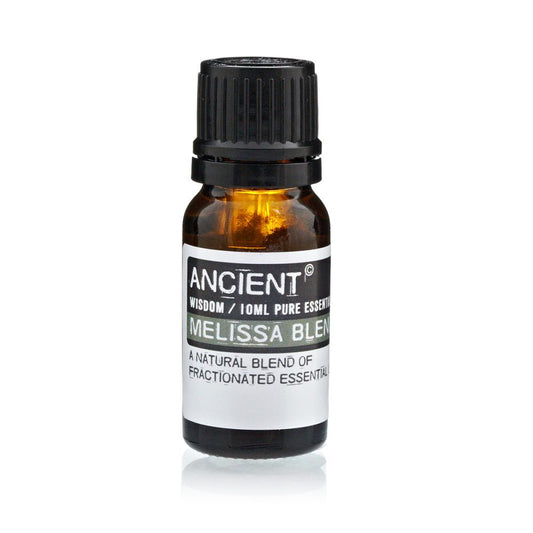 A brown glass bottle sits on a white surface. A label reads "ANCIENT WISDOM / 10ML PURE ESSENTIAL MELISSA BLEND A NATURAL BLEND OF FRACTIONATED ESSENTIAL".