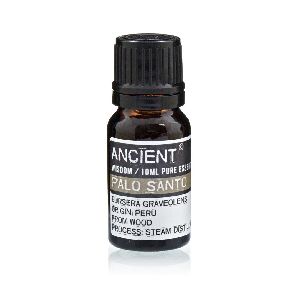 A small bottle contains essential oil on a white surface. The label reads: "ANCIENT WISDOM / 10ML PURE ESSEN PALO SANTO BÜRSERĀ GRAVEOLENS ORIGIN: PERU FROM WOOD PROCESS: STEAM DISTILL"