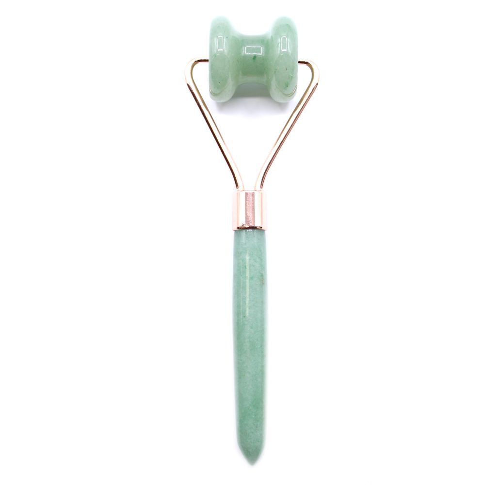 A light green jade roller rests on a white background. The roller's handle and rolling pin are both light green, with a rose gold holder.