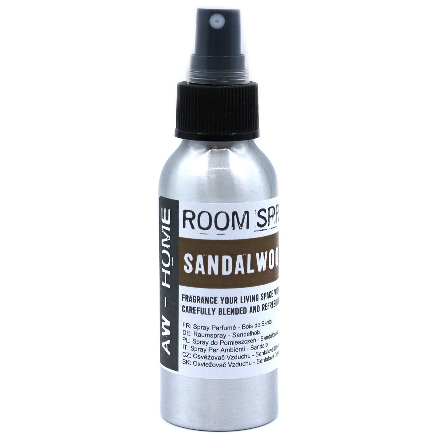 A silver spray bottle, dispensing room spray, sits against a white background. The label reads: "ROOM SPRAY SANDALWOOD," "FRAGRANCE YOUR LIVING SPACE WITH CAREFULLY BLENDED AND REFRESHING," followed by translations in several languages.