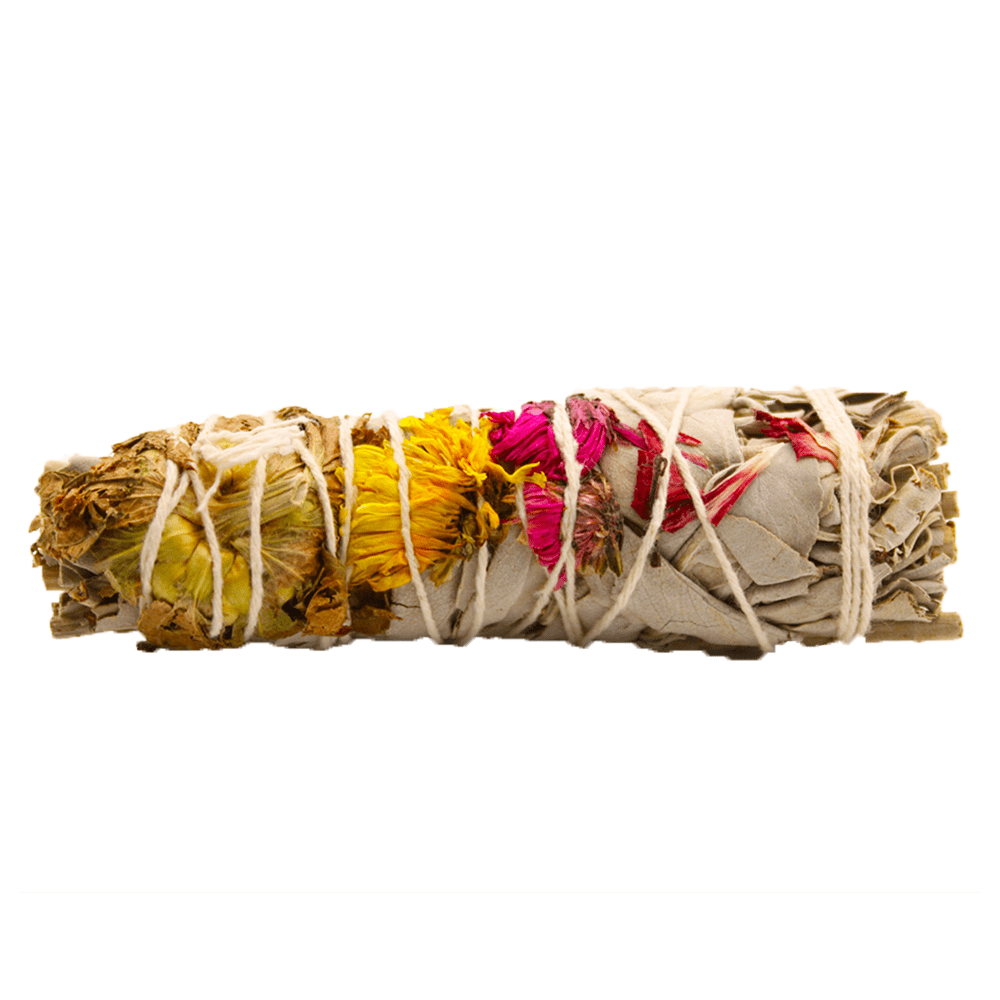 A sage bundle lies horizontally, tied with white string, featuring dried yellow and red flowers, against a white background.