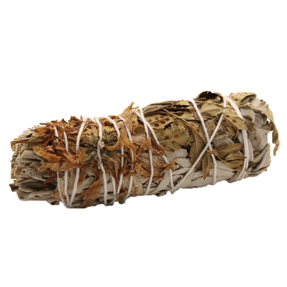 Sage bundle lies horizontally, wrapped with white string and adorned with dried leaves/flowers on a white background.
