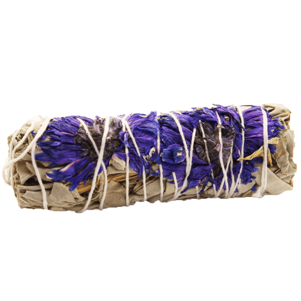 A sage bundle with purple flowers is wrapped with white string. It lies on a white, blank background.
