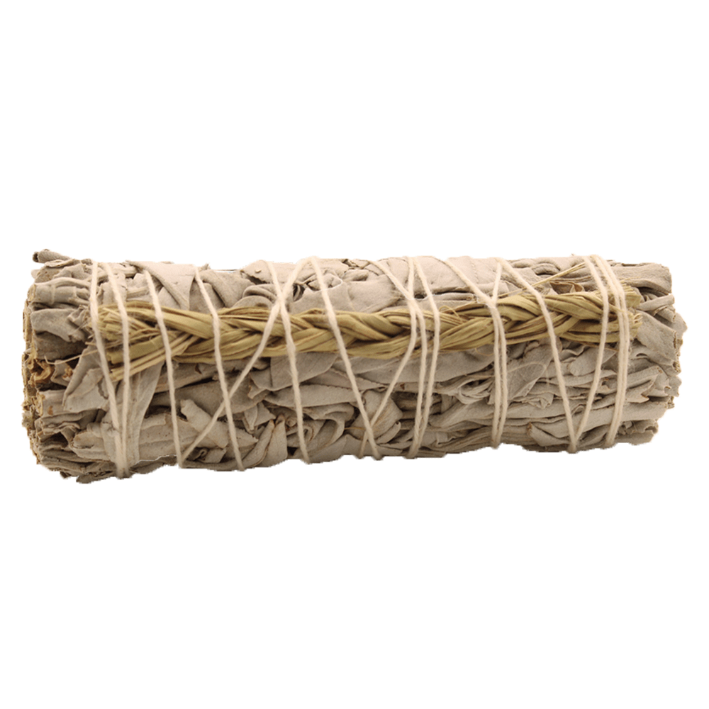A bundle of dried sage leaves, wrapped with twine and a small woven piece of dried grass, sits against a white backdrop.