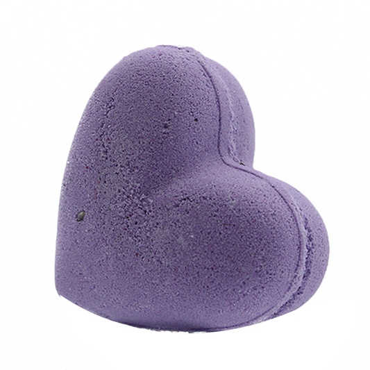 Purple heart-shaped bath bomb sitting against a plain white background.