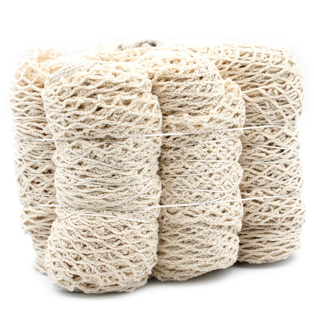 Four rolls of woven beige thread, tied together with white twine, sit on a white surface. The rolls are slightly different sizes.