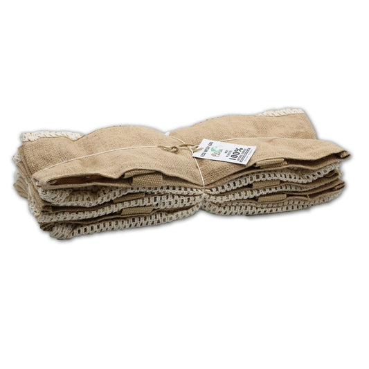 A stack of tan burlap bags are tied together with twine, displaying tags that read “ECO MESH BAG,” planet logo, “100% ORGANIC COTTON".