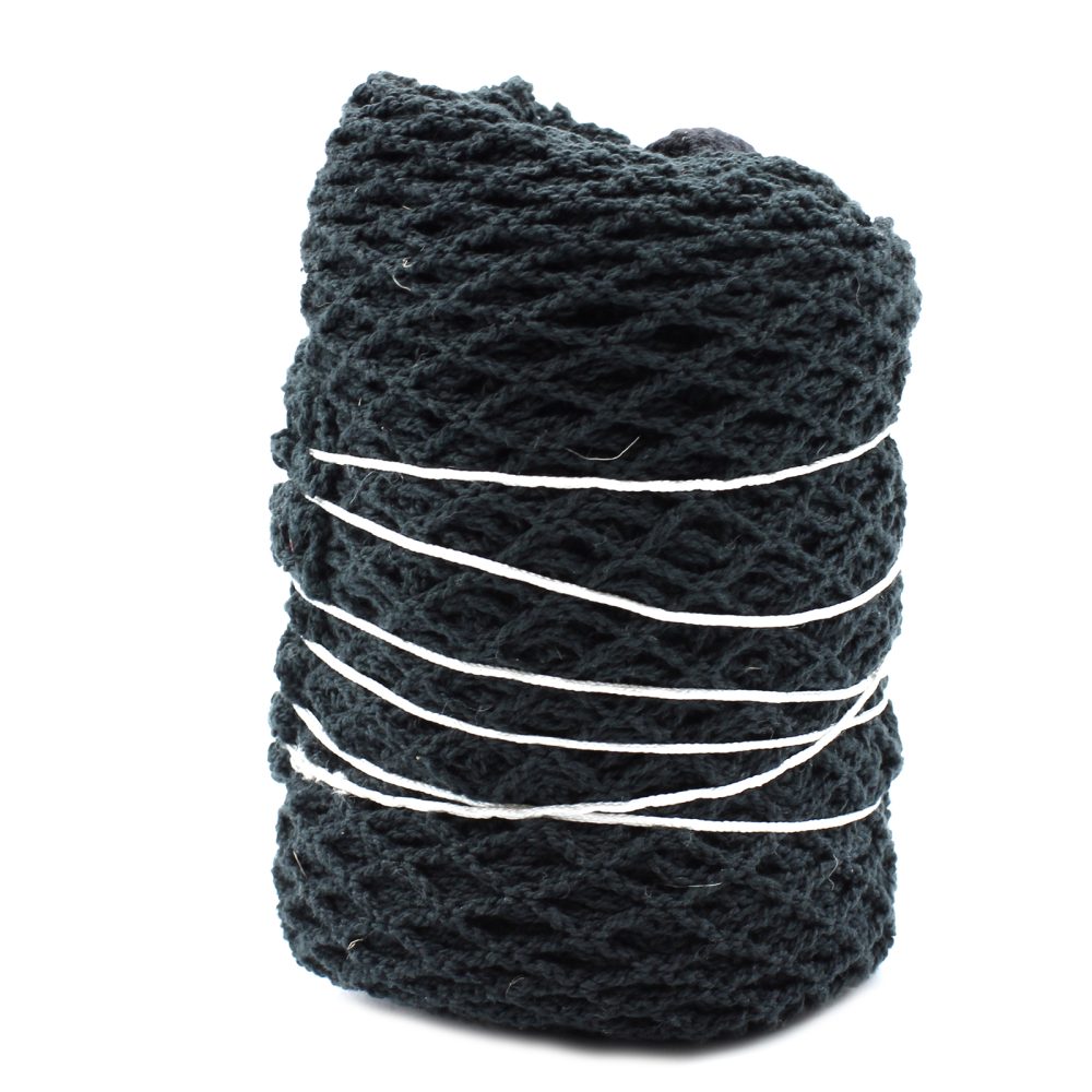 A cylinder of dark netting is bundled together with several horizontal white strings wrapping around it in a plain, white space.